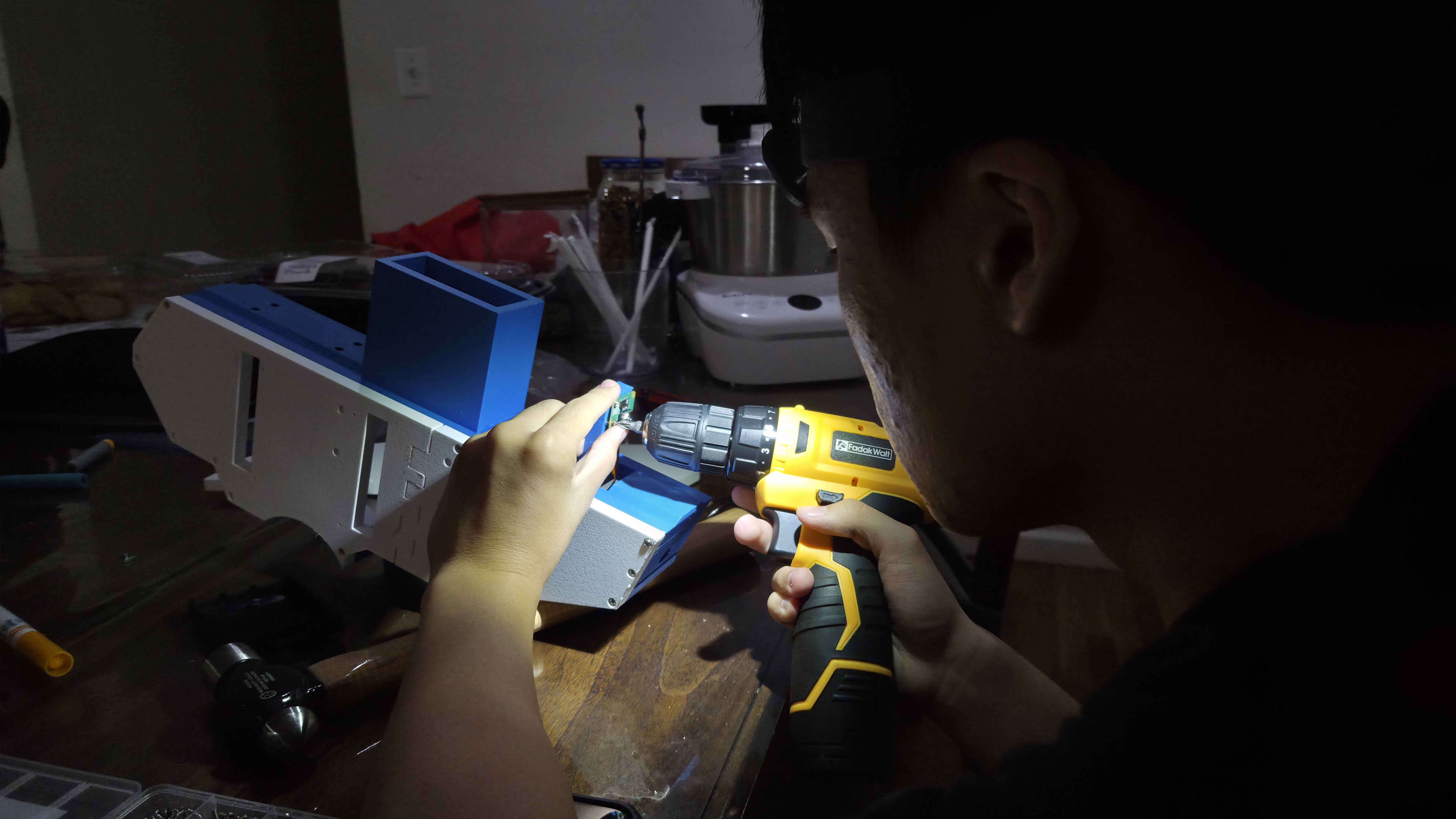 Aegis-5 printed turret parts being assembled at a workbench
